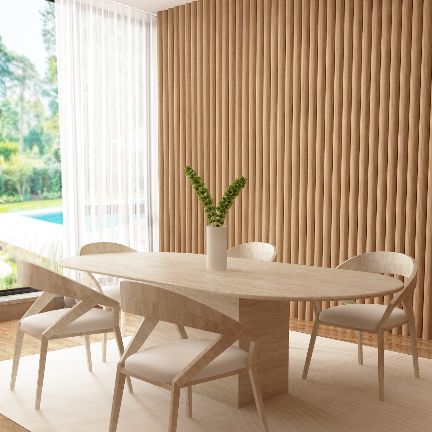 A modern dining room features the TRAVERTABLE Oval Travertine Dining Table with Block Base, four matching chairs, a white vase with green flowers, wood panel walls, light wood floor, sheer curtains framing a view of trees and a pool.