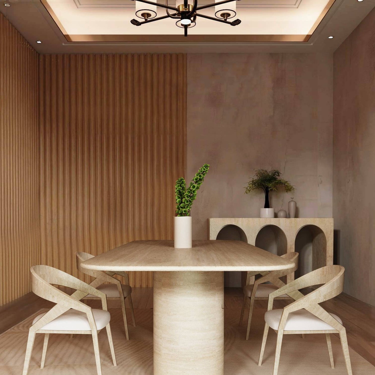 A modern dining room features the TRAVERTABLE Rectangular Travertine Dining Table with a sloped natural stone base, four matching chairs, a cream rug, and a wooden accent wall. A white vase with green stems sits on the table; decor accents the sideboard.