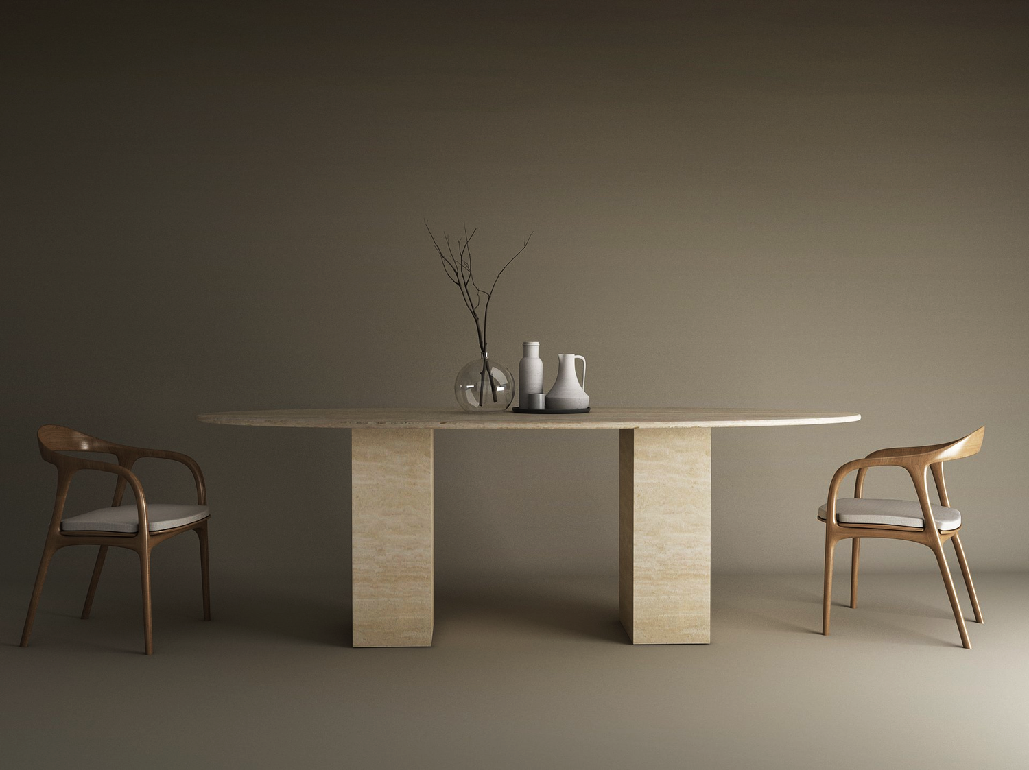 A minimalist dining setup with the TRAVERTABLE Ellips Travertine Dining Table featuring a travertine stone base, two wooden chairs with white cushions, and neutral-toned vases and a bare branch centerpiece against a plain background.