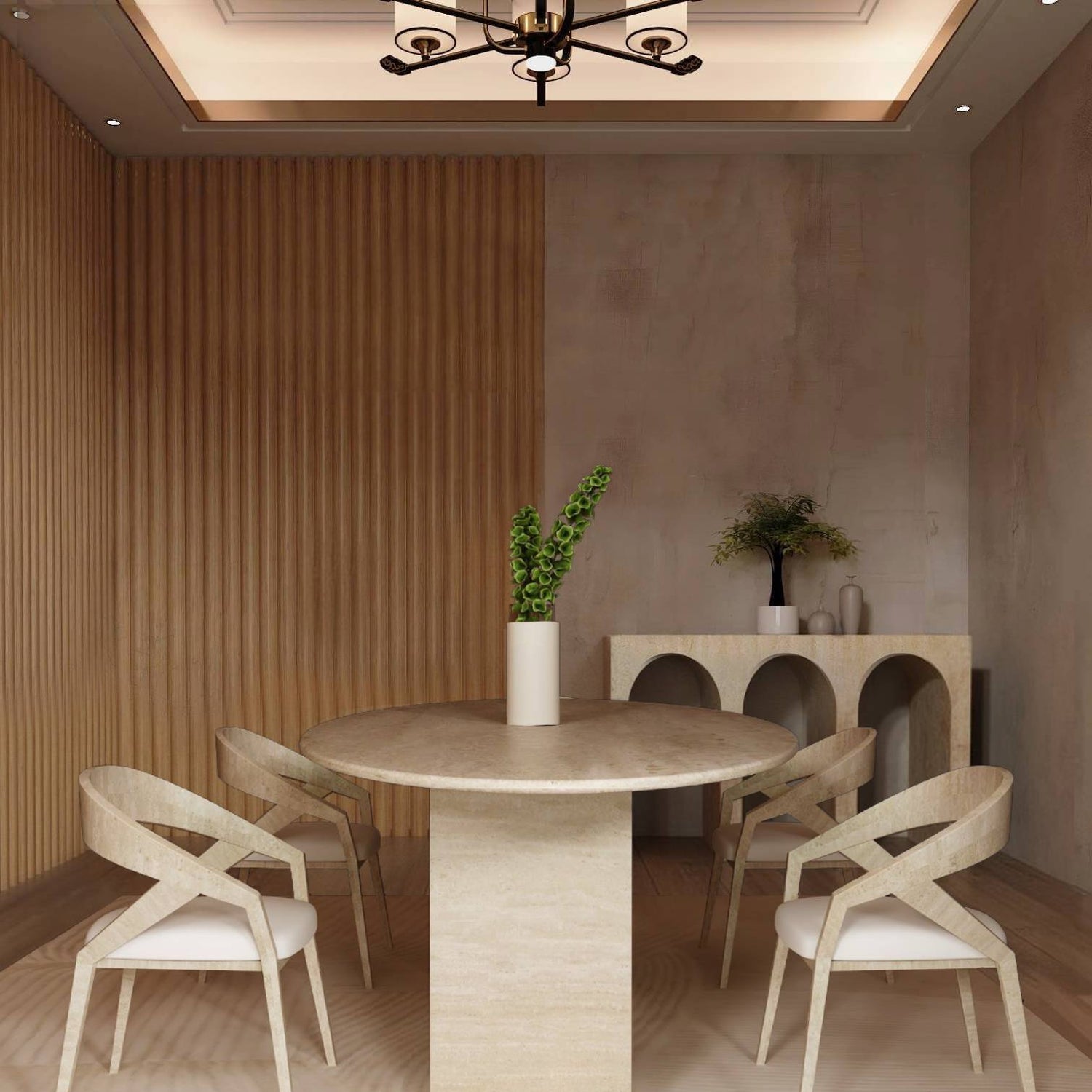 A modern dining room featuring the TRAVERTABLE Ellips Travertine Dining Table with Rectangular Pedestal Base, four light chairs, a tall vase of green leaves, and a sideboard with decor against textured beige walls and wood flooring.