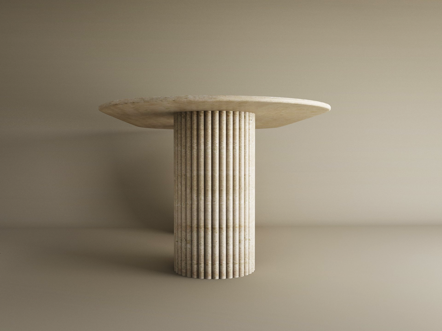 The TRAVERTABLE Oval Travertine Dining Table features a customizable organic stone top and a vertical groove base, set against a plain beige background.