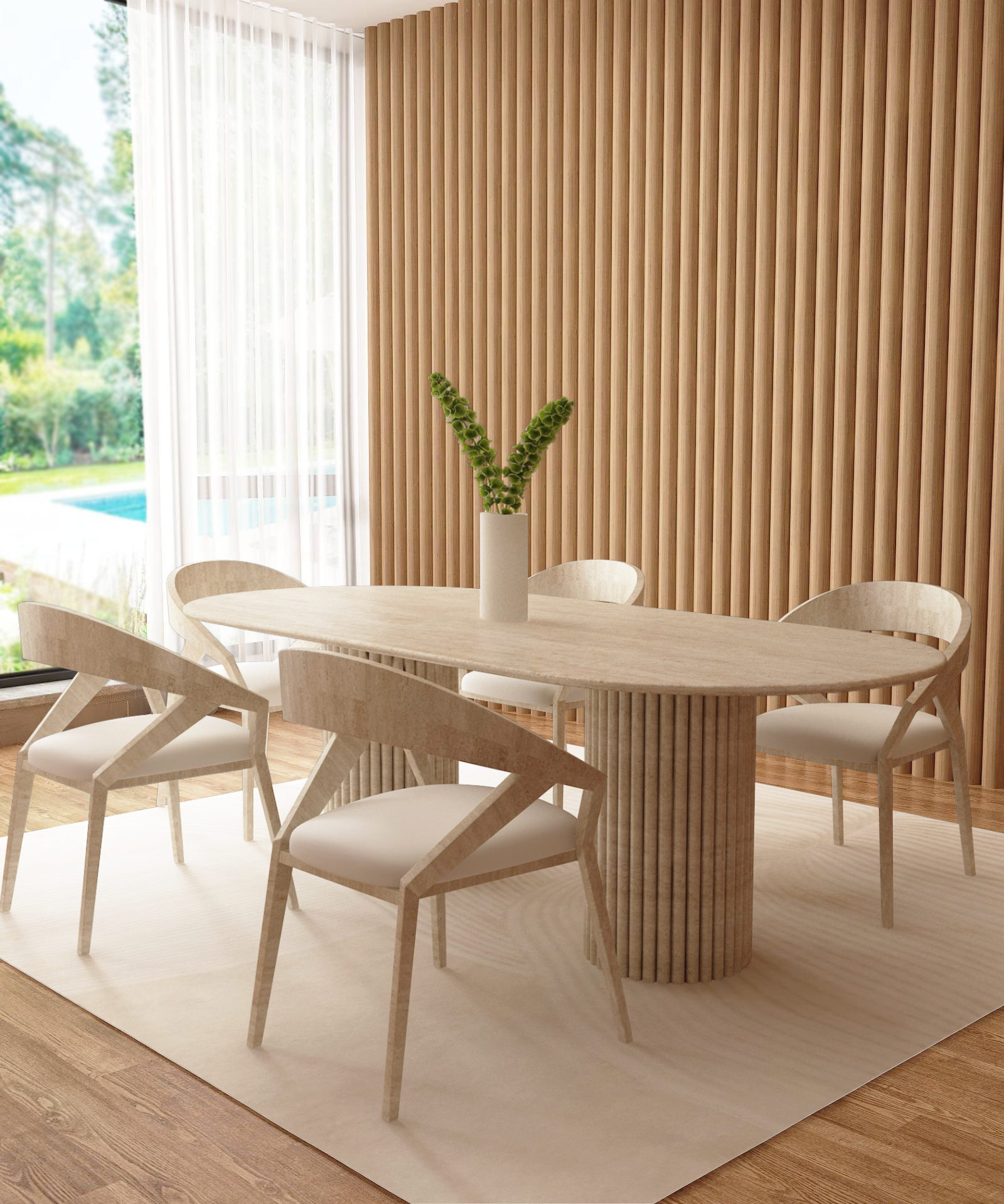 A modern dining room features the TRAVERTABLE Oval Travertine Dining Table with Vertical Groove Base, matching chairs, a white vase with green stems, beige floor rug, and vertical wooden paneling. Large windows showcase lush greenery and a pool.
