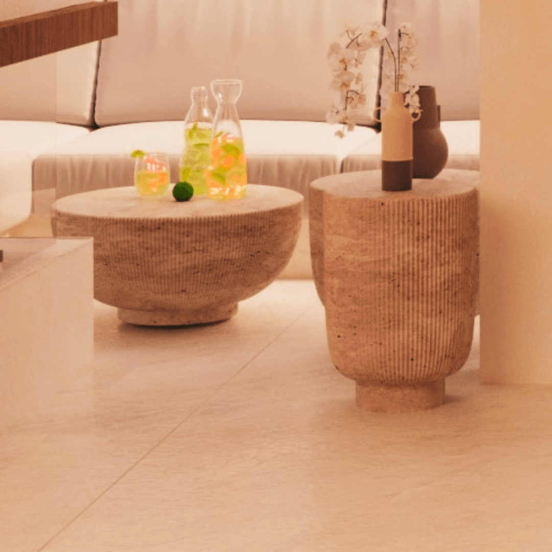 Side view of the Classic Travertine Pedestal Coffee Table highlighting its sturdy pedestal base