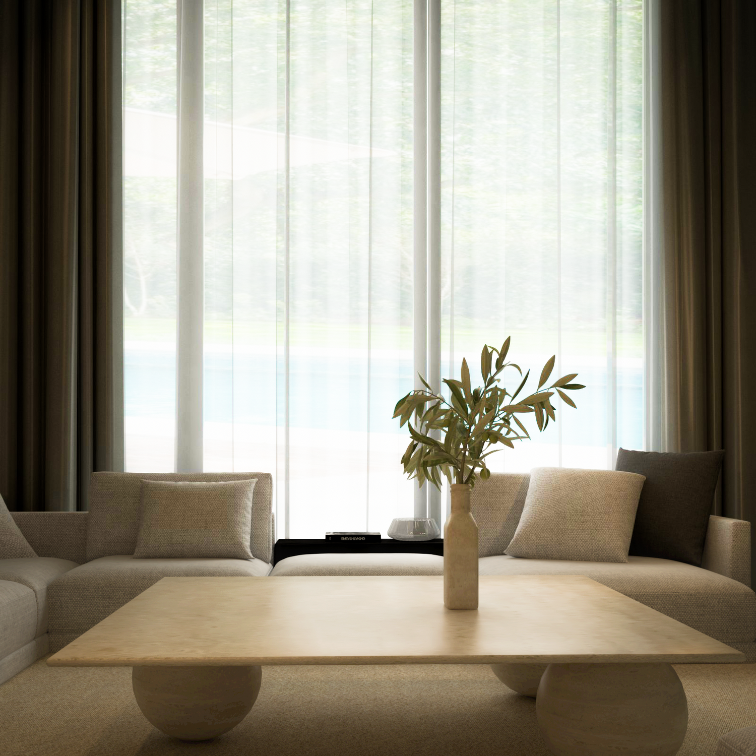 A modern living room features two beige armchairs, sheer curtains, and the TRAVERTABLE Square Travertine Coffee Table with Stone Ball Base—its sculptural travertine design and a ceramic vase with green leaves add an organic touch.