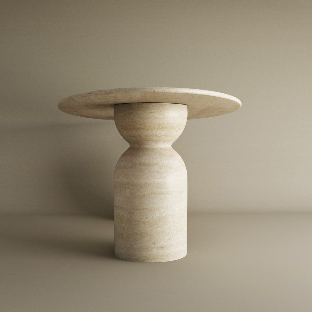 The TRAVERTABLE Ellips Travertine Dining Table features a minimal, hourglass-shaped organic travertine stone base and natural stone top. Its symmetric, polished design offers customizable elegance—an heirloom piece for any space.