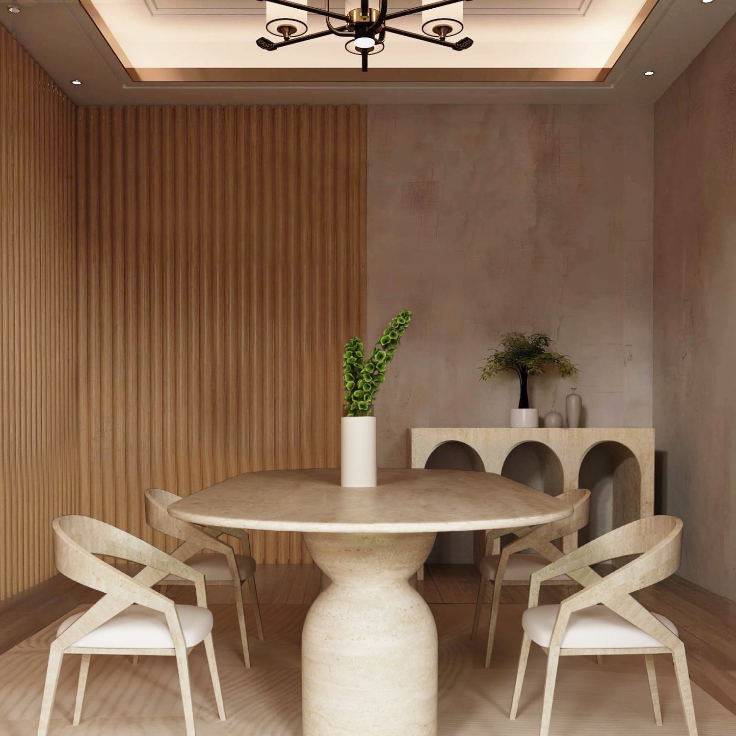 A modern dining room with the TRAVERTABLE Oval Travertine Dining Table featuring a sculptural round stone base, paired with four light wood cross-back chairs, a white vase with green leaves, and a console displaying decorative objects against a textured wall.