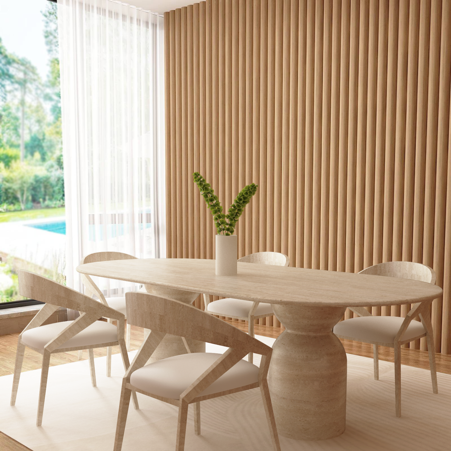 A modern dining room with a TRAVERTABLE Oval Travertine Dining Table featuring a sculptural round, organic stone base, five matching chairs, white vase with greenery, beige floor-to-ceiling panels, large window, and views of the garden and pool.