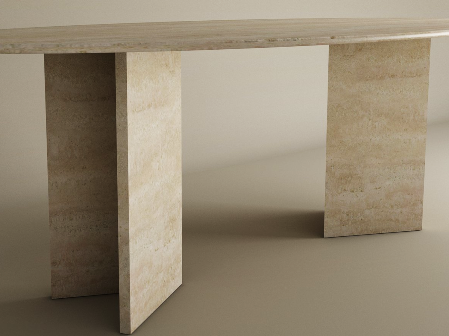 The TRAVERTABLE Ellips Travertine Dining Table features a thick, oval natural stone top and a split-V travertine base in beige. The modern table is customizable and set against a plain, neutral background.