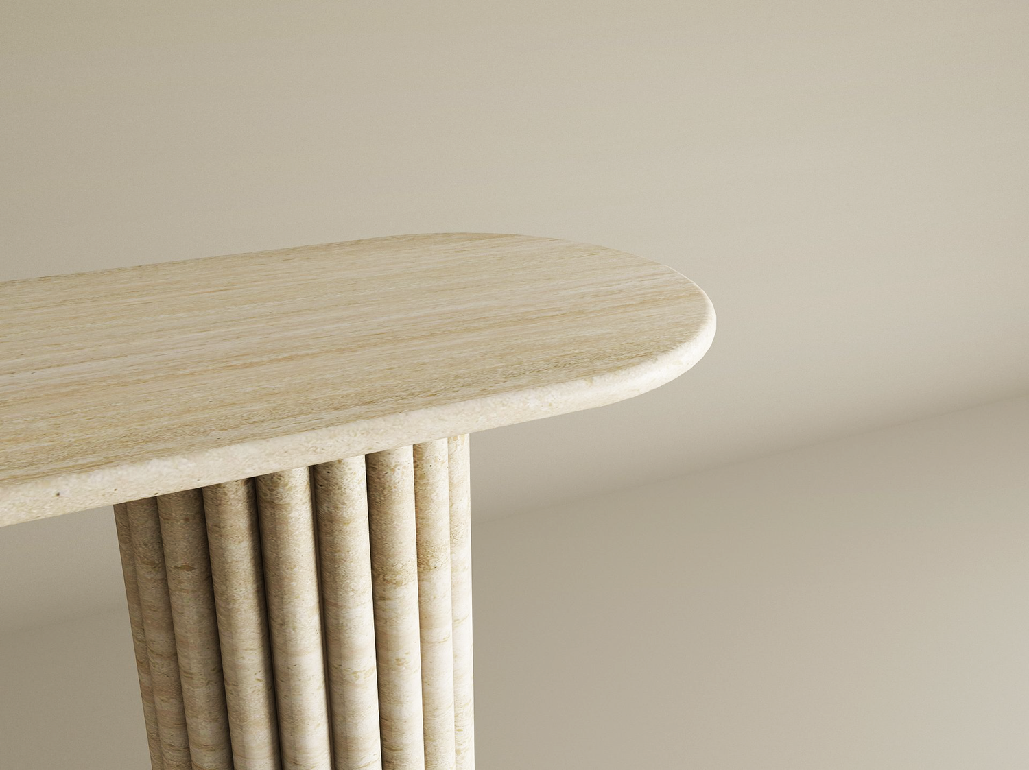 A close-up of the TRAVERTABLE Ovale Travertine Console Table, featuring a beige organic stone top and sculptural vertical groove base, shown against a plain neutral background. Customizable design.