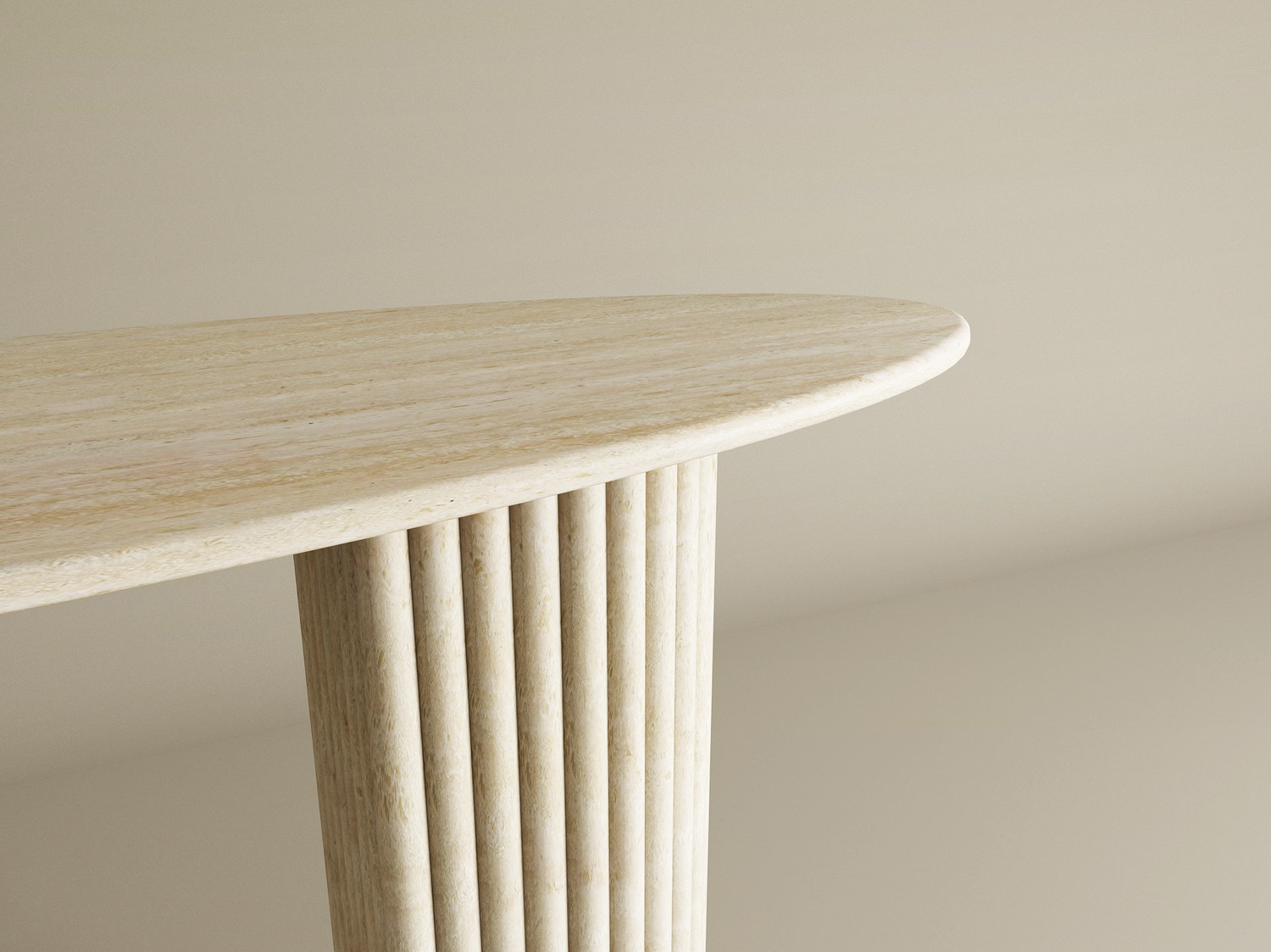 A close-up of the TRAVERTABLE Ellips Travertine Console Table with Fluted Round Base highlights its sculptural, solid stone form and refined luxury, set against a soft beige backdrop.