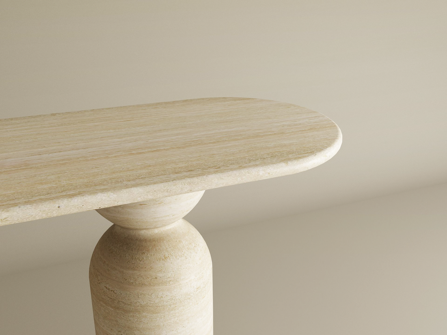 The TRAVERTABLE Ovale Travertine Console Table features a sculptural round organic stone base and rounded oval edge, shown here against a neutral backdrop—a customizable statement piece.