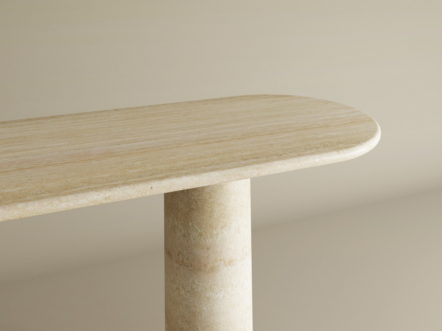 A close-up of TRAVERTABLE’s Ovale Travertine Console Table, featuring a light travertine top with rounded edge and a conical organic stone base, highlights its sculptural elegance against a beige background.