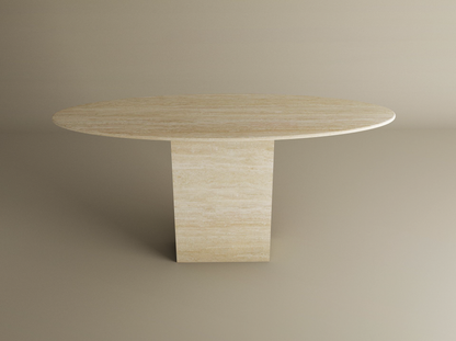 The TRAVERTABLE Ellips Travertine Console Table with Block Base features a light beige natural stone pedestal, blending elegance and modern style, displayed against a plain beige background.