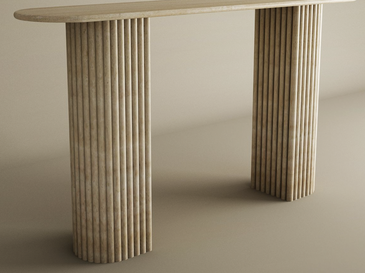 The TRAVERTABLE Ovale Travertine Console Table features a solid, customizable design with an oval top and fluted round base in beige travertine, offering classical elegance on a matching surface and background.