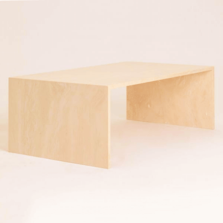 Customizable travertine coffee table displayed in a modern living room setting