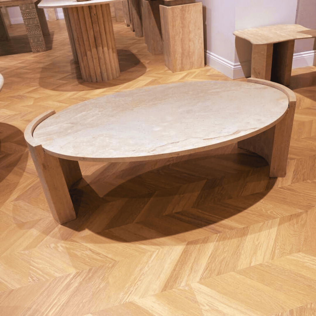 oval shape travertine coffee table in showroom