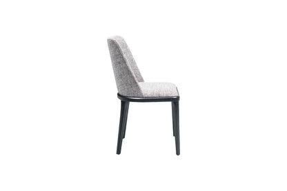 Side view of the Travertable Comfort Dining Chair, featuring a gray fabric seat and backrest with black metal legs. This chair showcases a minimalist, modern design and an ergonomic structure for maximum comfort.