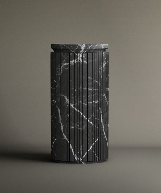 The TRAVERTABLE Nero Marquina Round Marble Pedestal Vanity Sink, featuring vertical grooves and white veining, stands upright with a matching flat lid on a neutral background—ideal for stylish bathroom design.
