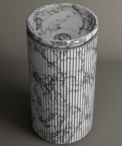 The TRAVERTABLE Calacatta Round Marble Pedestal Vanity Sink features vertical grooves and elegant gray veining on a light background, showcasing Italian artistry in premium Calacatta marble.