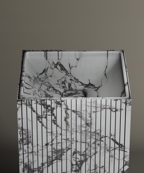 The TRAVERTABLE Calacatta Square Fluted Marble Pedestal Vanity Sink features striking black and white veining, a vertically grooved exterior, and a smooth interior, shown against a simple, neutral backdrop.