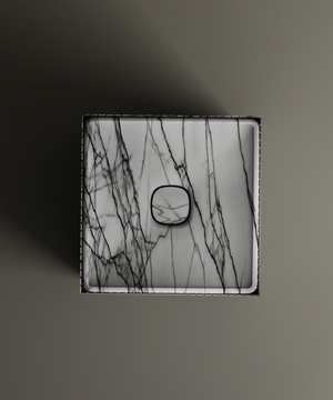 The TRAVERTABLE Lilac Square Fluted Marble Pedestal Vanity Sink showcases bold black veining and a central drain, viewed from above on a matte background—a striking centerpiece for any modern space.
