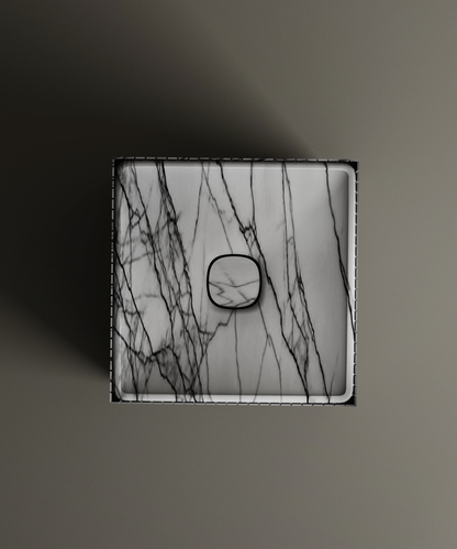 The TRAVERTABLE Lilac Square Fluted Marble Pedestal Vanity Sink showcases bold black veining and a central drain, viewed from above on a matte background—a striking centerpiece for any modern space.