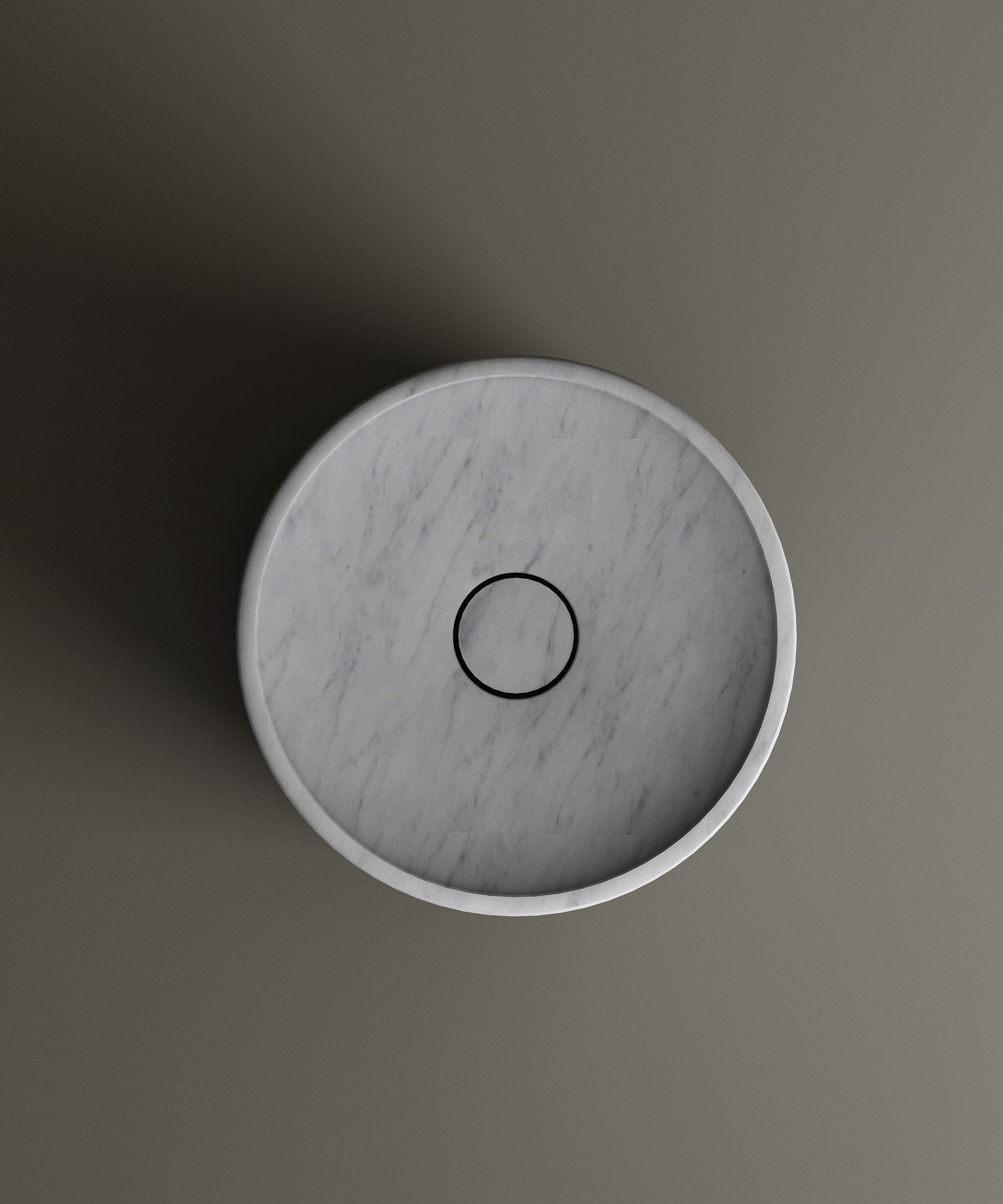 A top-down view of the TRAVERTABLE Carrara Round Marble Pedestal Vanity Sink with a black drain, set on a plain gray background. Light casts a shadow to the left, highlighting Italian-inspired elegance.