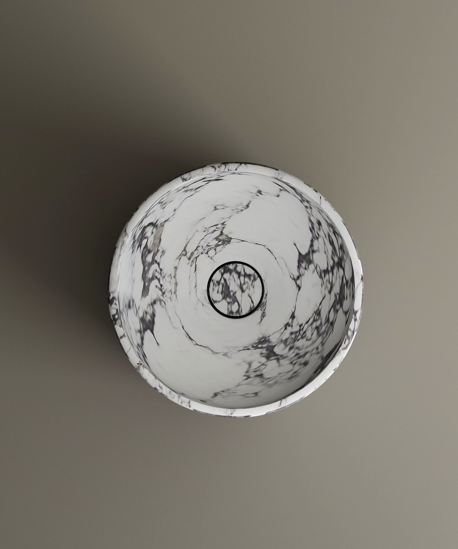 The TRAVERTABLE Calacatta Round Marble Pedestal Vanity Sink features elegant gray veining and a centered drain, showcasing Italian craftsmanship. Viewed from above against a taupe background, it enhances any bathroom space.