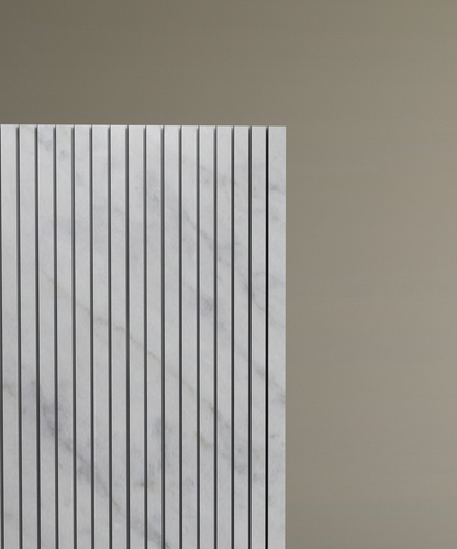 Only the left half of the TRAVERTABLE Carrara Square Fluted Marble Pedestal Vanity Sink, featuring vertical grooves in white marble and designed for contemporary bathrooms, is visible against a plain light brown background.