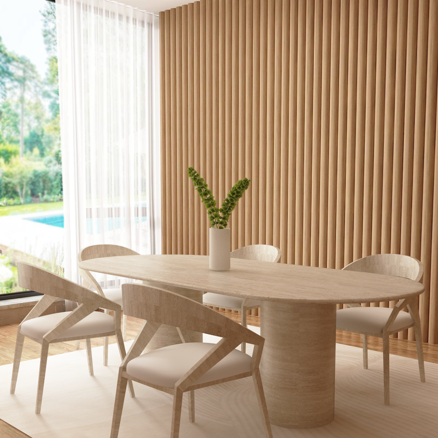 A modern dining room features the TRAVERTABLE Oval Travertine Dining Table with a smooth cylinder pure travertine base, four matching chairs, a white vase with green stems, floor-to-ceiling windows, wood slat wall, and views of trees and a pool.